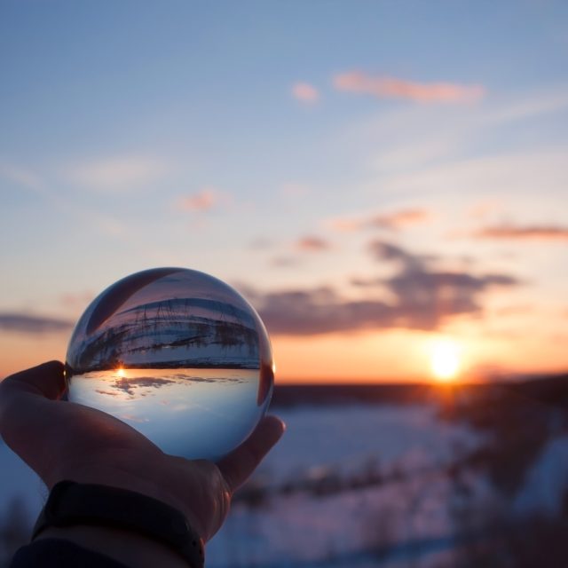 Beautiful,Scenic,View,Through,Lens,Of,Crystal,Ball,On,Snow