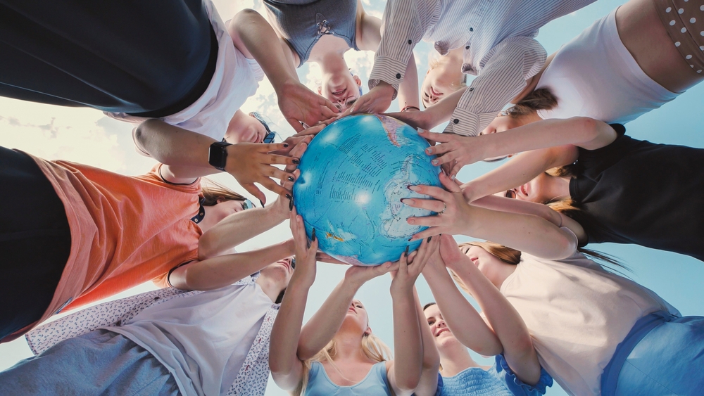 Group,Of,School,Friends,Holding,A,Globe,,Symbolizing,Environmental,Awareness,